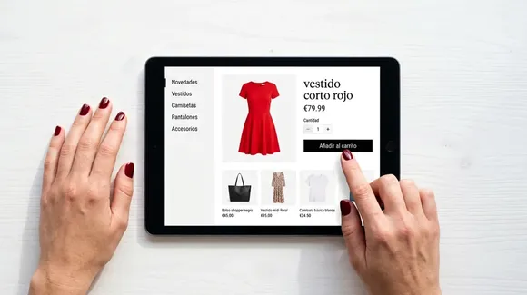 A person browses an online clothing store on a tablet, viewing a red dress priced at €79.99 with the option to add it to the cart.