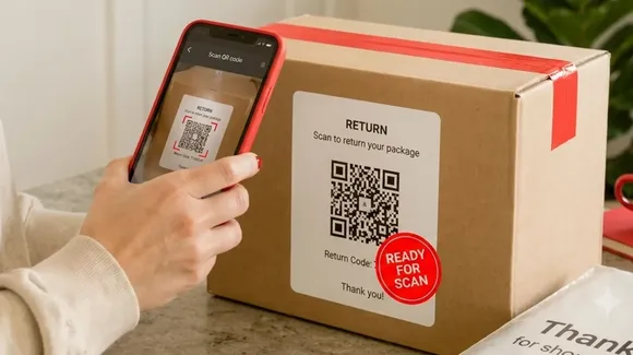 A person scans a QR code labeled “RETURN” on a package using a smartphone; a red sticker says “READY FOR SCAN.”.