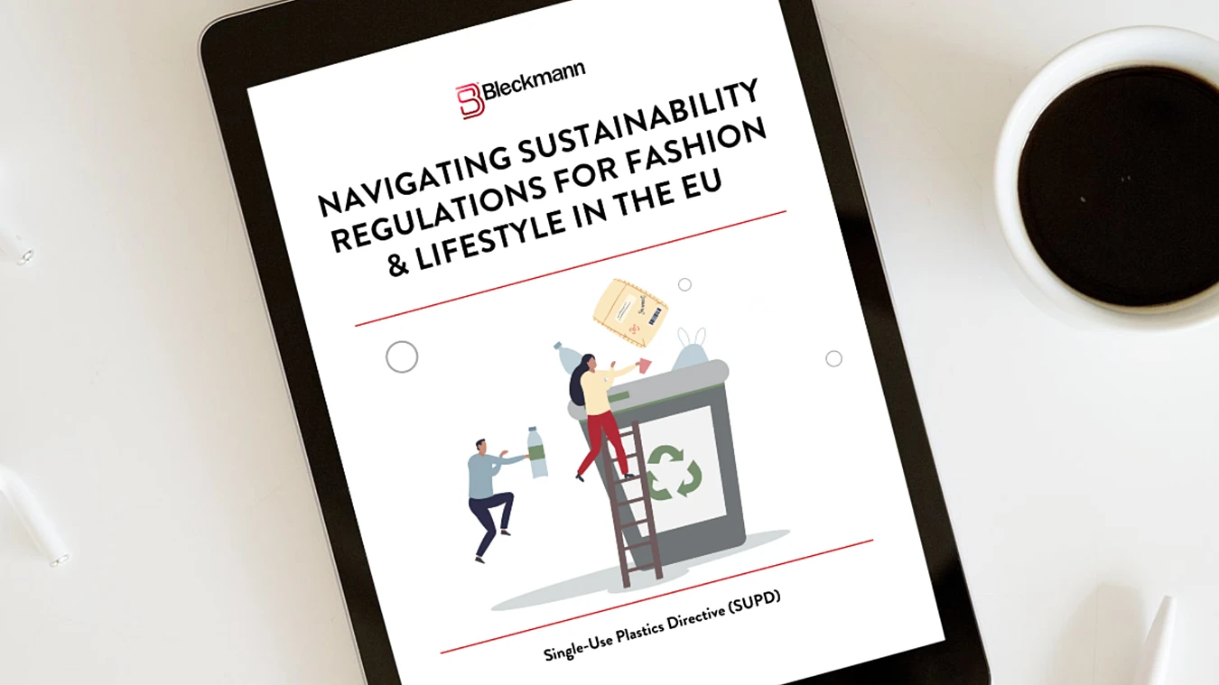 A digital tablet displays a document titled "Navigating Sustainability Regulations for Fashion & Lifestyle in the EU" with illustrations of people recycling.