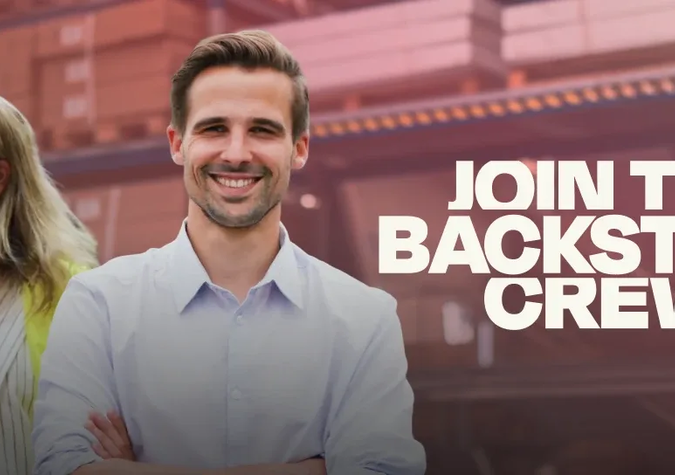 A man smiling with arms crossed stands in front of a woman and warehouse shelves; text reads “Join the Backstage Crew.”.