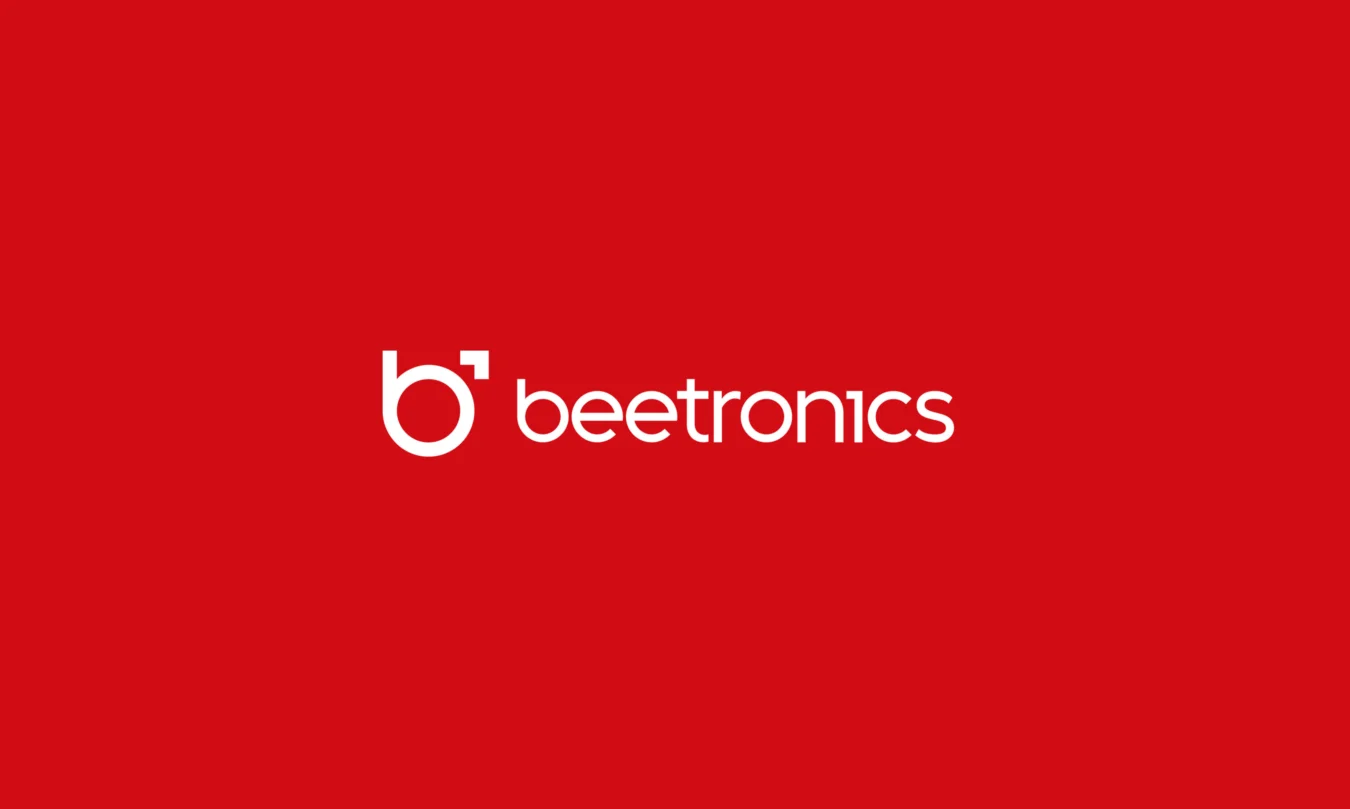 White "beetronics" logo with a stylized lowercase "b" on a solid red background.