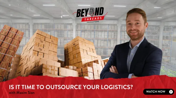 Person in a suit stands in front of stacked cardboard boxes in a warehouse. Text reads: "Is It Time to Outsource Your Logistics?" followed by "with Maxim Sion.