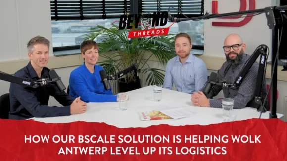 Four people sit at a table with microphones for a podcast recording. A sign reads "Beyond Threads" above, with text below about BScale helping Wolk Antwerp with logistics.