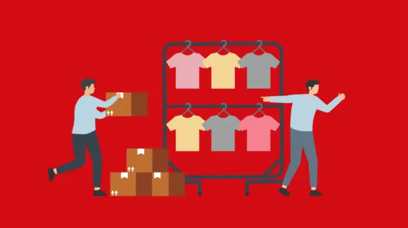 Two people organizing boxes and hanging shirts on a clothing rack, with several boxes stacked on the floor, against a red background.