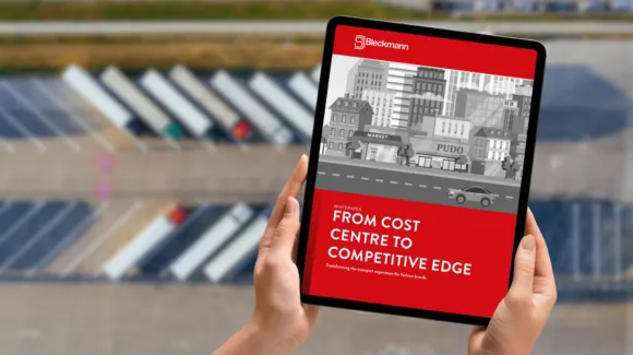 A person holds a tablet displaying a Bleckmann report titled “From Cost Centre to Competitive Edge,” with a cityscape illustration, above a blurred background of solar panels.