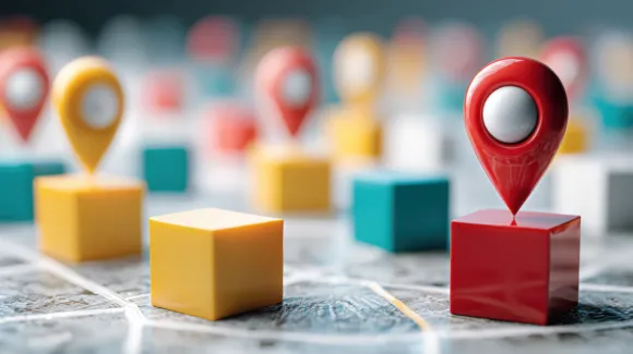 Colorful location markers on geometric blocks placed on a map, representing locations or destinations in a conceptual mapping setting.