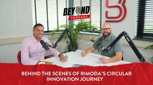 Two men sit at a table with microphones in a recording studio, preparing for a podcast episode about Rimoda's circular innovation journey.