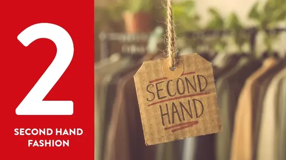 A cardboard tag labeled "Second Hand" hangs in front of clothing on racks, with a red banner reading "2 Second Hand Fashion" on the left side.