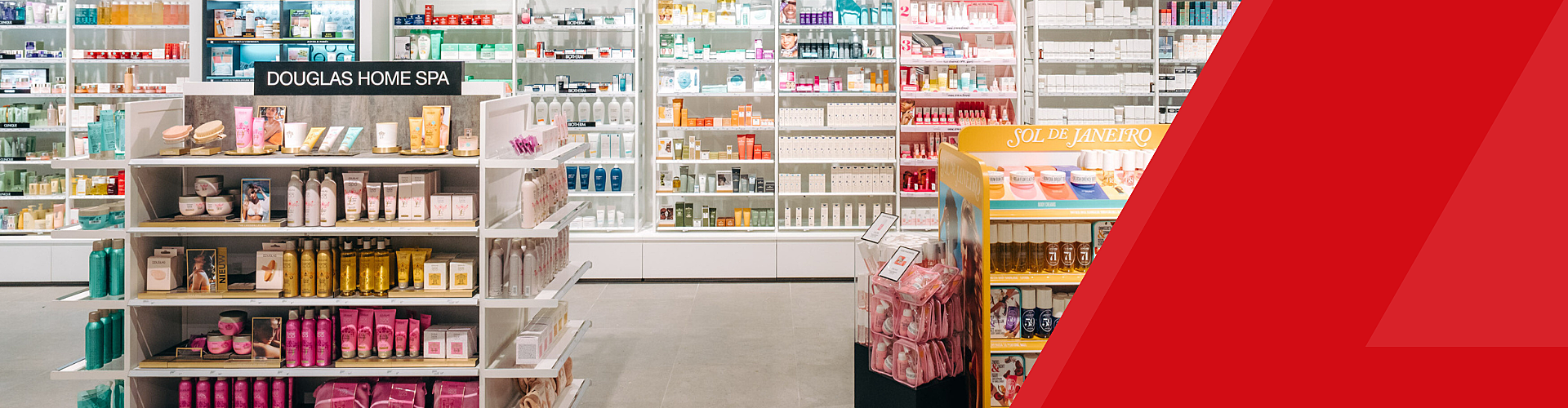 Shelves in a brightly lit store display various skincare and beauty products, with visible signs for "Douglas Home Spa" and "Sol de Janeiro.