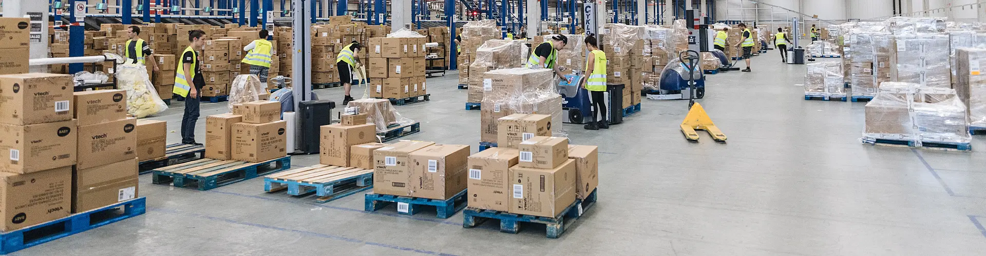 Warehouse with people moving packages