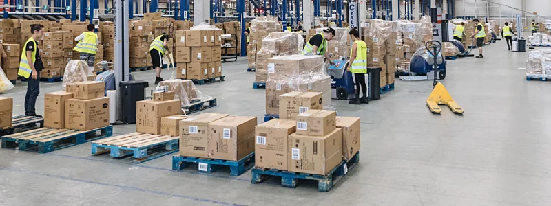Warehouse with people moving packages